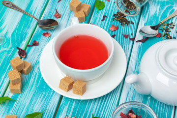 healthy herbal tea over blue background