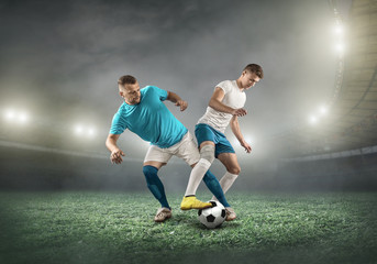 Fototapeta premium Soccer player on a football field in dynamic action at summer da