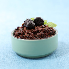 black olive tapenade on blue background