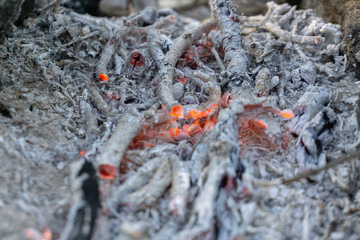 The ashes of fire in the furnace are very hot.