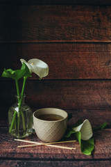 Cup of black tea on thewooden background