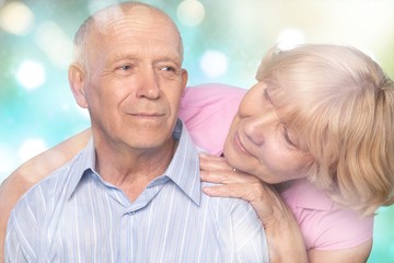 Portrait of happy senior couple smiling at home