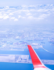 Bussiness and travel concept. Aerial view through window inside aircraft cabin with beautiful blue sky and cloud with sunlight, copy space, top view