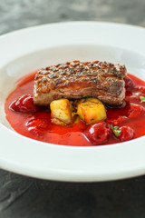 duck breast and berry sauce (meat roasting - main dish) snack. food background. top