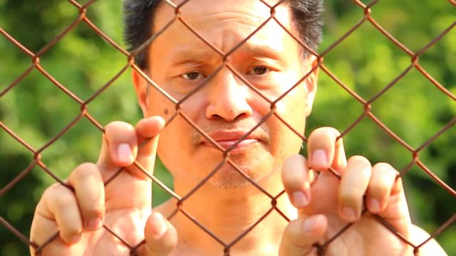 Man holding the fence, Chiangmai Thailand