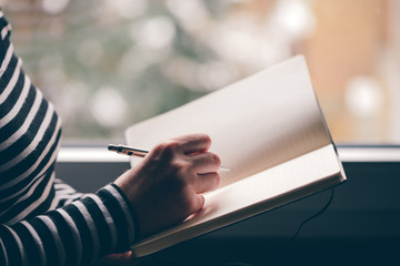 Pregnant woman keeping a pregnancy diary