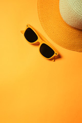 Straw hat and sunglasses in summer holiday concept
