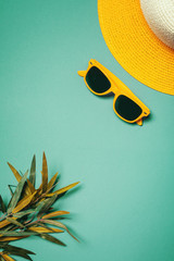 Straw hat and sunglasses in summer holiday concept