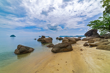 Beautiful black sand beach with boulders. Langkawi, Malaysia.