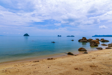 Fototapeta na wymiar Beautiful black sand beach with boulders. Langkawi, Malaysia.