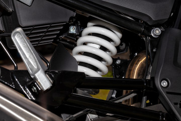 Detail of a motorcycle rear shock loaded with nitrogen gas