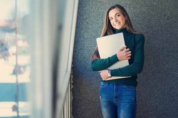 women with laptop in modern office