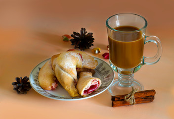 Breakfast with coffee and bagels with cherry jam.