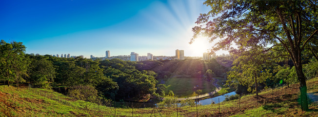 Municipal park of Ribeirão Preto - São Paulo, Brazil, panoramic view of the city of Ribeirão Preto from the municipal park Curupira at dusk with blue sky.  Panoramic photo