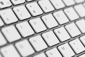 white keyboard of a modern laptop. - close up.