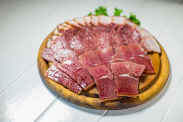Meat plate set with salami, bacon, hamon