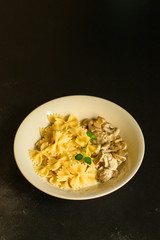 pasta Farfalle with mushrooms, cream sauce and cheese (main dish) snack. food background. top