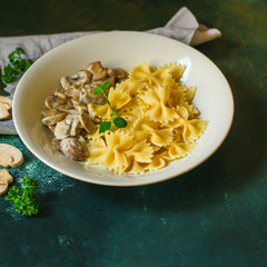pasta Farfalle with mushrooms, cream sauce and cheese (main dish) snack. food background. top