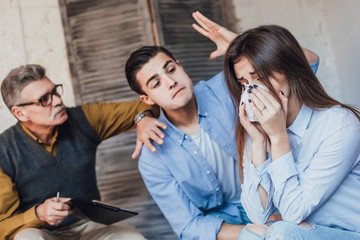 People are waiting for an advice from their therapist, thy in quarrel, woman is crying! Problems!