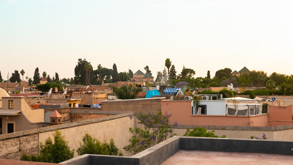 Fototapeta na wymiar Top Panoramic view from rooftop Marocco Marrakesh with the old part of town Medina and minaret market