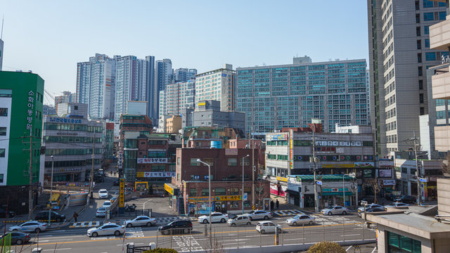 Seoul, South Korea - March 2018: typical area of ​​the city where you can see buildings with signs and roads with traffic on a beautiful day.