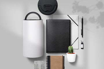 branding items mockups including packaging roll and black portfolio