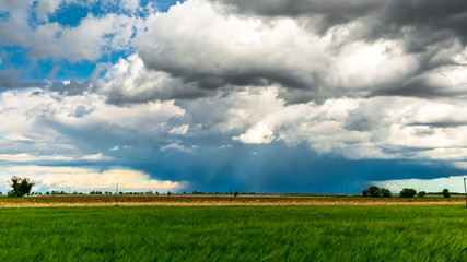 Fototapeta na wymiar Big storm in the fields of Italy