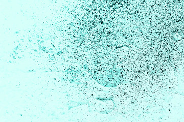 Vintage azure background. Rough painted wall of turquoise color. Imperfect plane of cyan colored. Uneven old decorative toned backdrop of aqzure tint. Texture of teal hue. Ornamental stony surface.