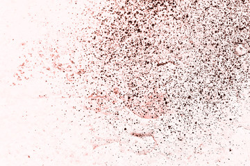 Vintage pink background. Rough painted wall of living coral color. Imperfect plane of beige colored. Uneven old decorative toned backdrop of beige tint. Texture of pink hue. Ornamental stony surface.