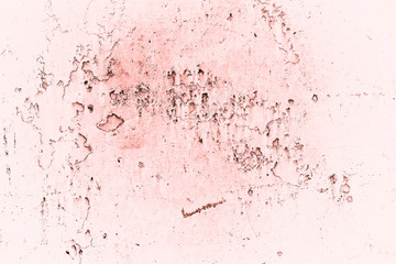 Vintage pink background. Rough painted wall of living coral color. Imperfect plane of beige colored. Uneven old decorative toned backdrop of beige tint. Texture of pink hue. Ornamental stony surface.