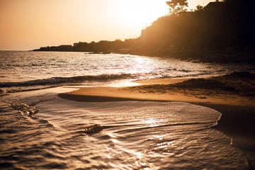 Naklejka premium Amazing warm sunset at the beach on Corfu island, Greece