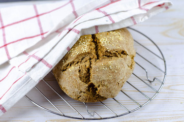 fresh rustic whole wheat bread baked at home, bio ingredients, very healthy with sesame