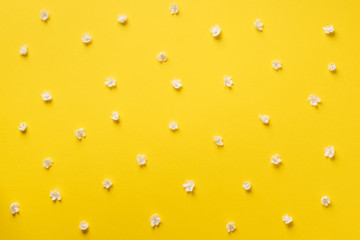 Daisy pattern. Top view. Flat lay. Floral pattern of white chamomile flowers on yellow background. Summer concept