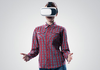 Girl in mask experiencing virtual reality as new entertainment device