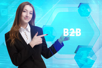 The concept of business, technology, the Internet and the network. A young entrepreneur working on a virtual screen of the future and sees the inscription: B2B