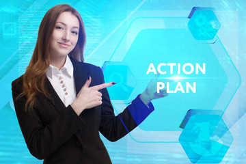 The concept of business, technology, the Internet and the network. A young entrepreneur working on a virtual screen of the future and sees the inscription: Action plan