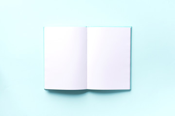 Top view of open pink, turquoise notebooks on pastel blue background. Copy space. Woman business, study, back to school concept. Time managenet, to do list. Banner