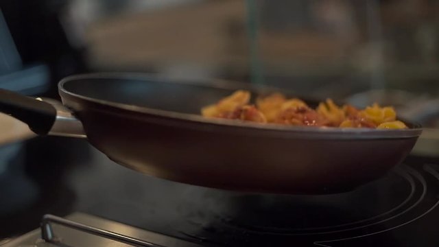Ingredients for pasta in pan slow motion video.