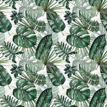 Watercolor seamless pattern with tropical leaves: palms, monstera, passion fruit.