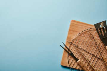 top view of barbecue cooking equipment on blue background
