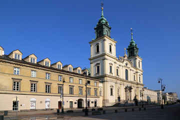 Fototapeta na wymiar The Church of the Holy Cross on the central pedestrian street Krakow suburb.