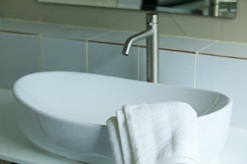 Obraz na płótnie Canvas Towels on the washbasin in the bathroom, shower equipment
