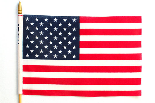 United States of America flag hanging on white background