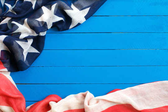 American flag on blue wooden background.The Flag Of The United States Of America. The place to advertise, template.