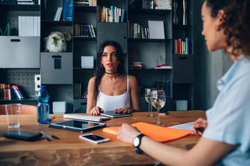 young freelancer women having informal meeting in coworking office