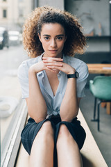 portrait of young caucasian woman looking camera