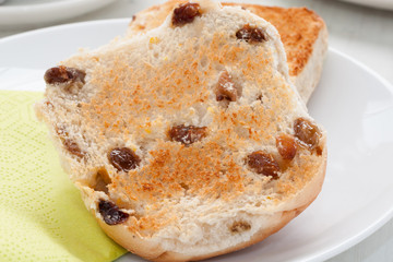 Hot teacakes a traditional British sweet bun filled with raisins and a popular afternoon tea snack