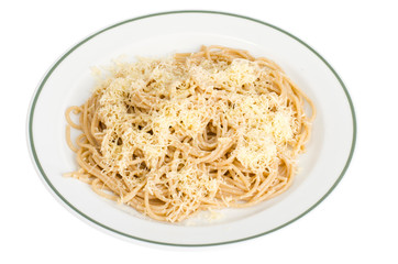 Whole grain spaghetti with cheese on white plate