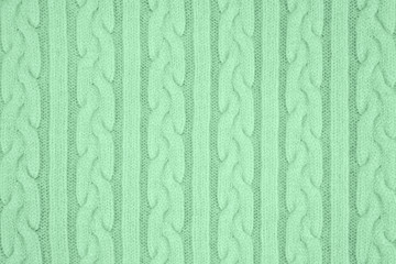 Trendy mint colored Knitwear Fabric Texture with Pigtails and stripes. Repeating Machine Knitting Texture of Sweater. Knitted Background. Color of the year 2020