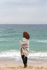 Lovely young redhead woman wearing autumn coat